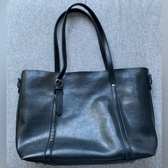 Black handbag with multiple interior pockets. - Picture 2 of 3